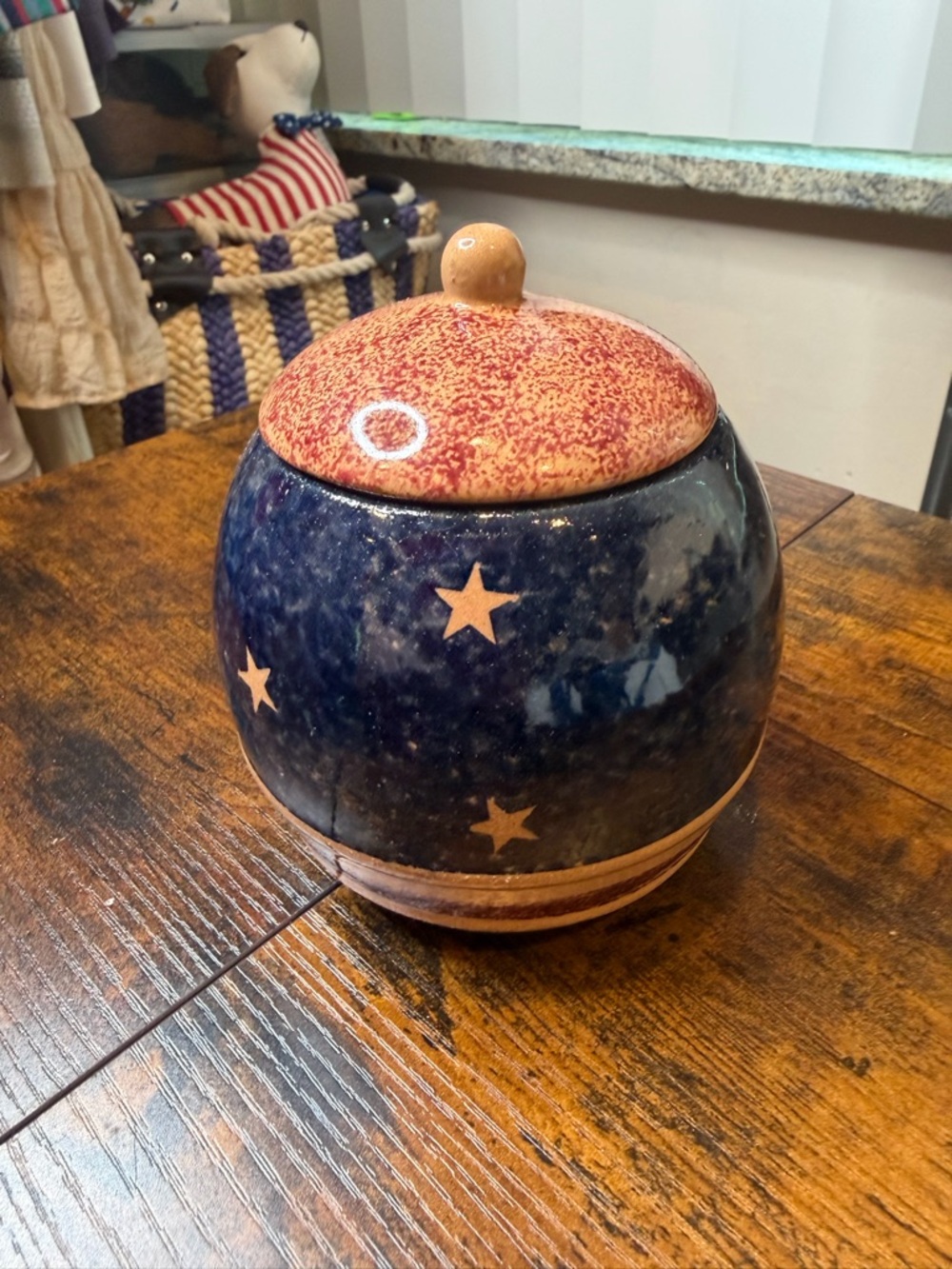 Beautiful handcrafted stoneware jar lid featuring a patriotic star design.
